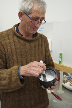 John getting the plaster mix just right.