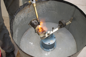 Heating process with acetylene torch.